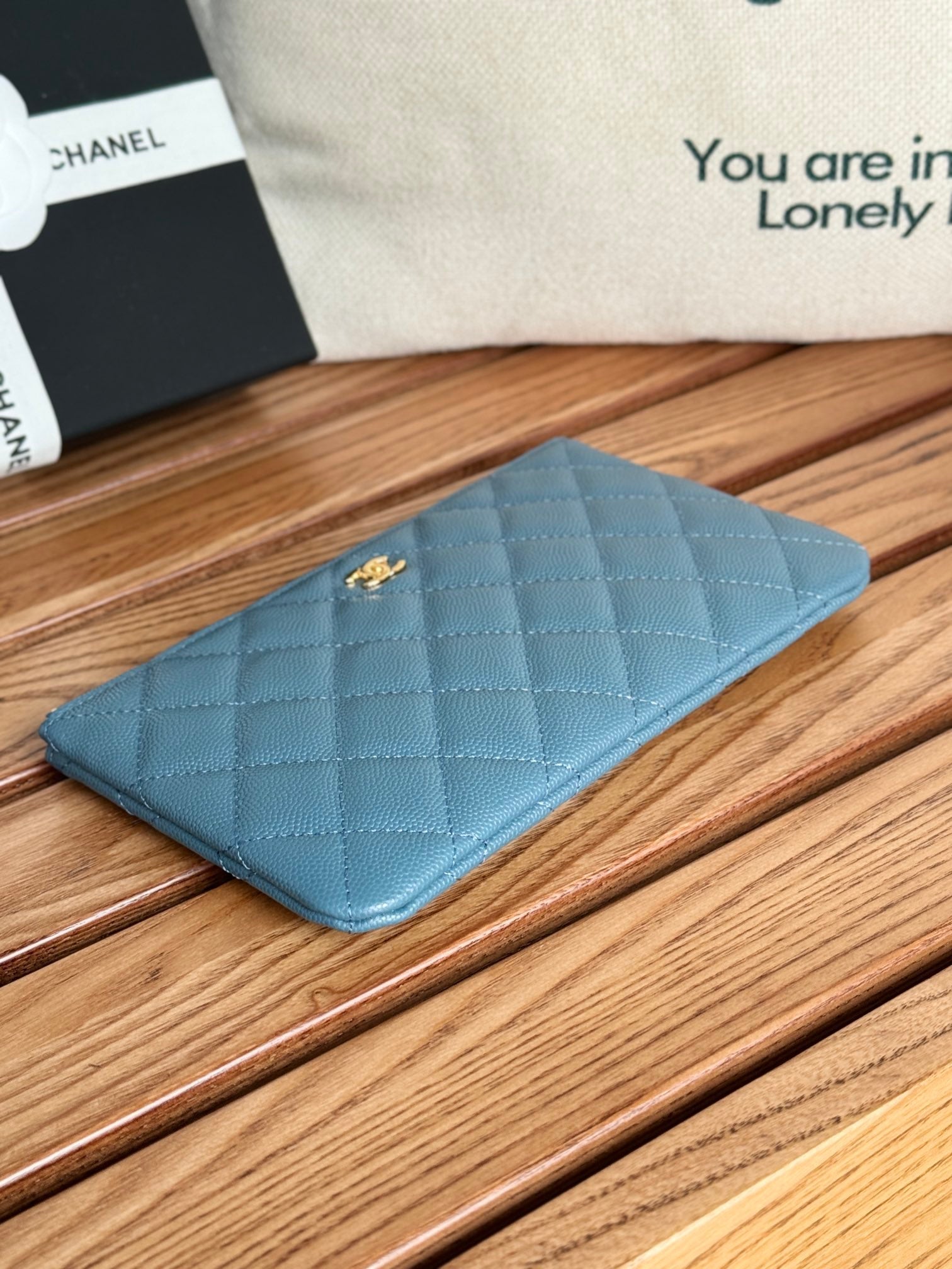 CC ZIPPED WALLET 20CM BLUE QUILTED CAVIAR GOLD HARDWARE
