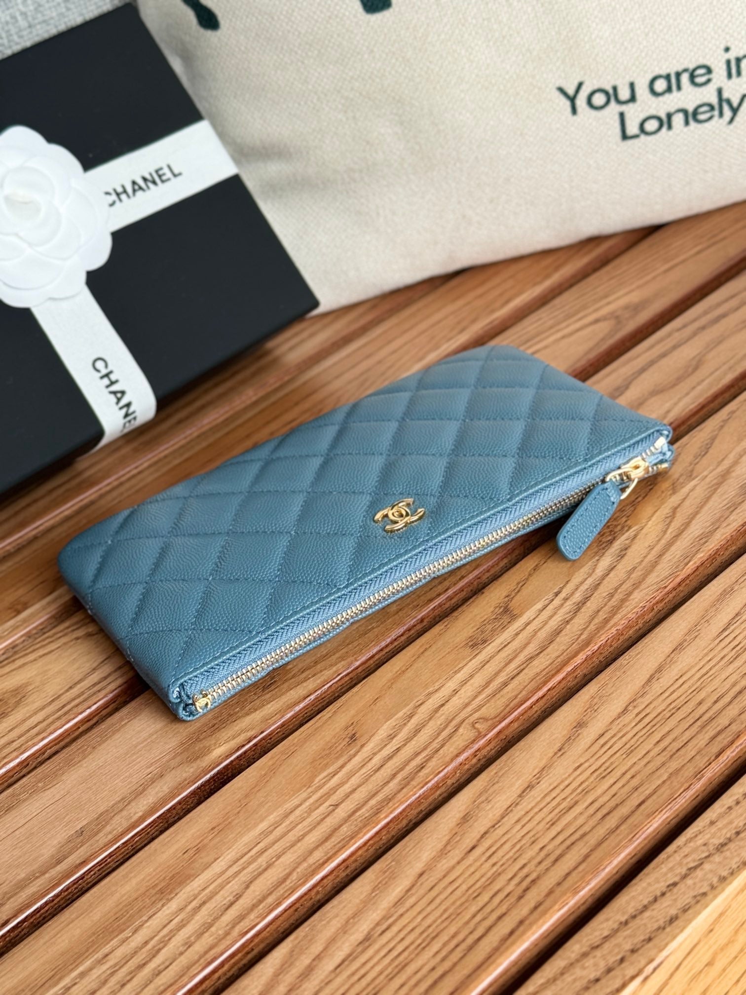 CC ZIPPED WALLET 20CM BLUE QUILTED CAVIAR GOLD HARDWARE