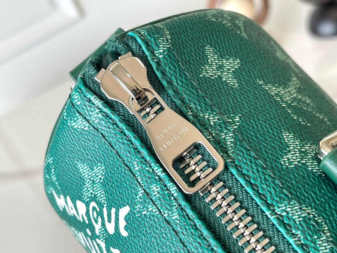 KEEPALL BANDOULIÈRE 25 EN TOILE VERT MONOGRAMME HERITAGE