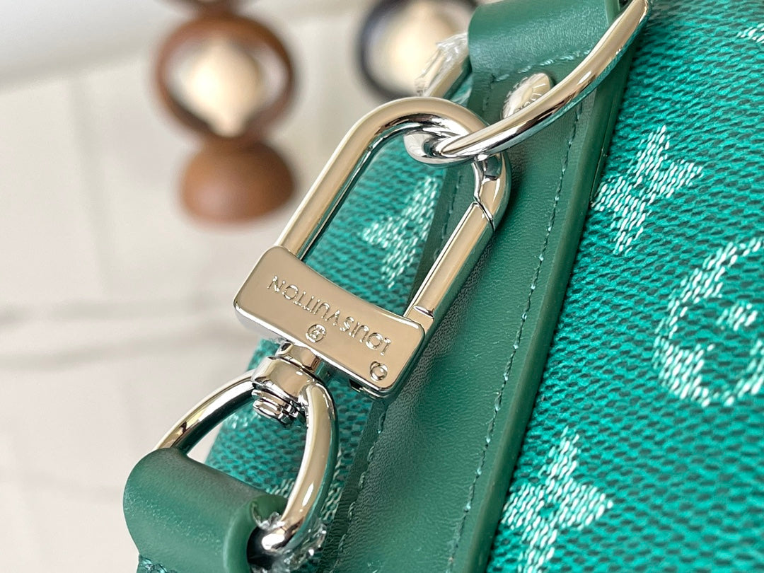 KEEPALL BANDOULIÈRE 25 EN TOILE VERT MONOGRAMME HERITAGE