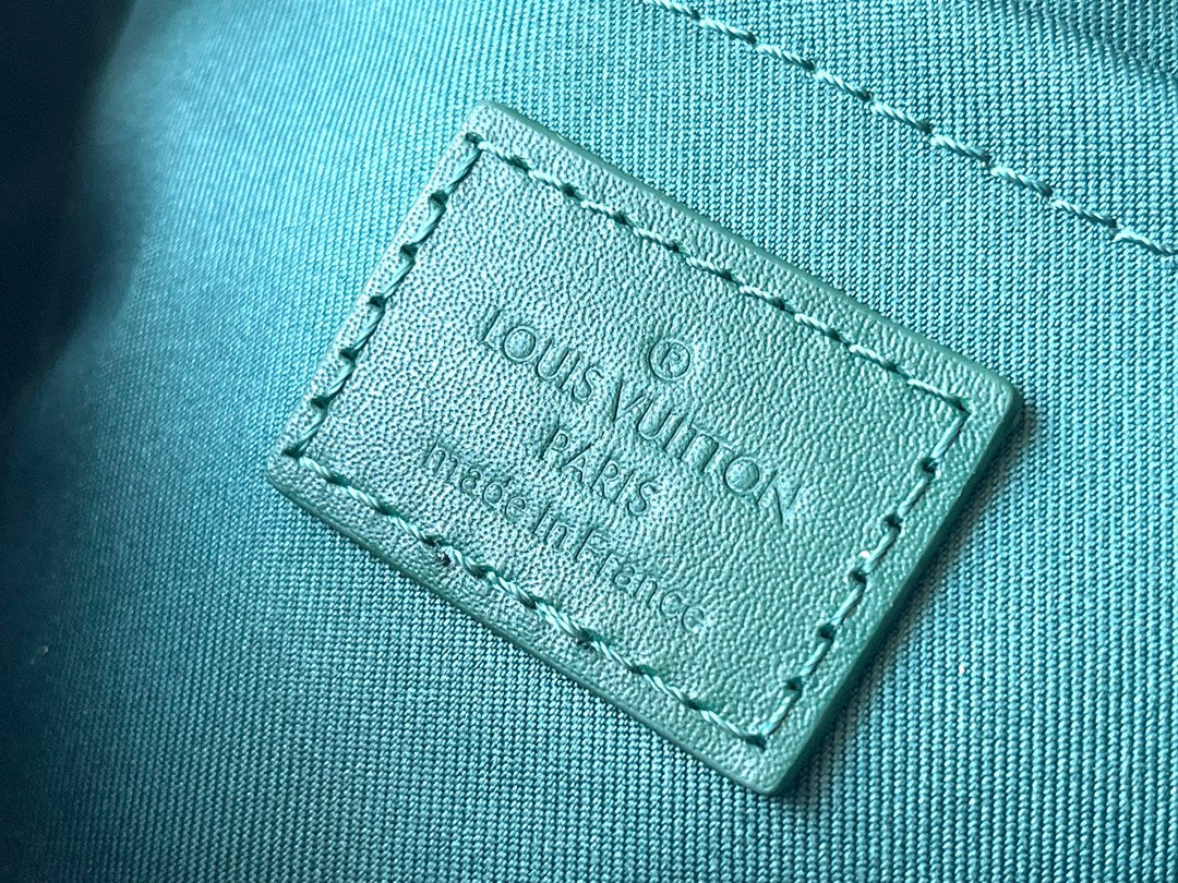 KEEPALL BANDOULIÈRE 25 EN TOILE VERT MONOGRAMME HERITAGE