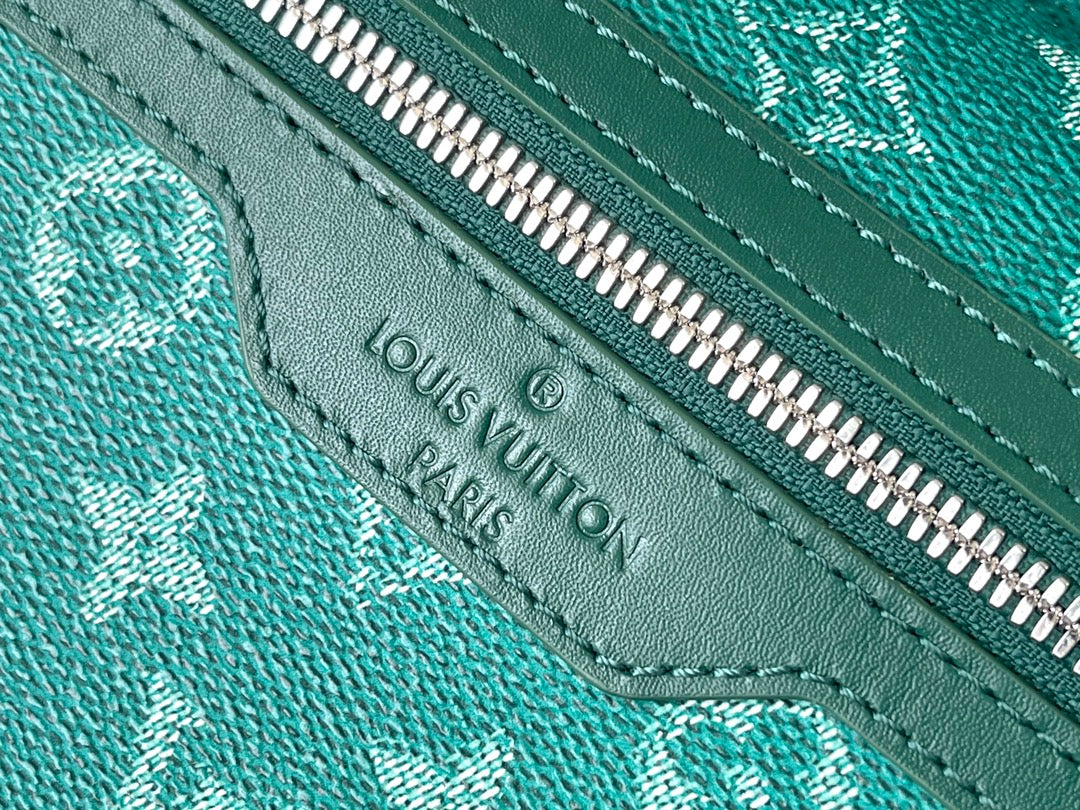 SAC À DOS DISCOVERY 38 EN TOILE HERITAGE MONOGRAMME VERTE