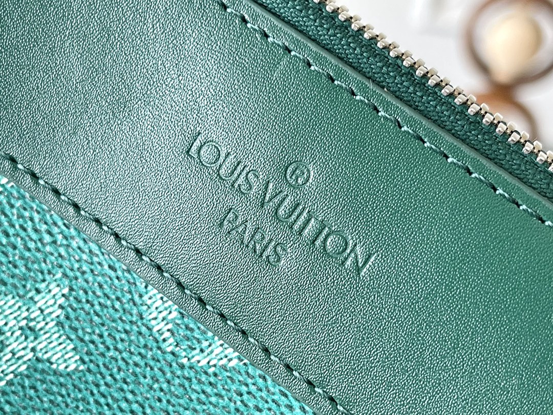 POCHETTE VOYAGE SOUPLE 32 EN TOILE MONOGRAMME VERTE HERITAGE