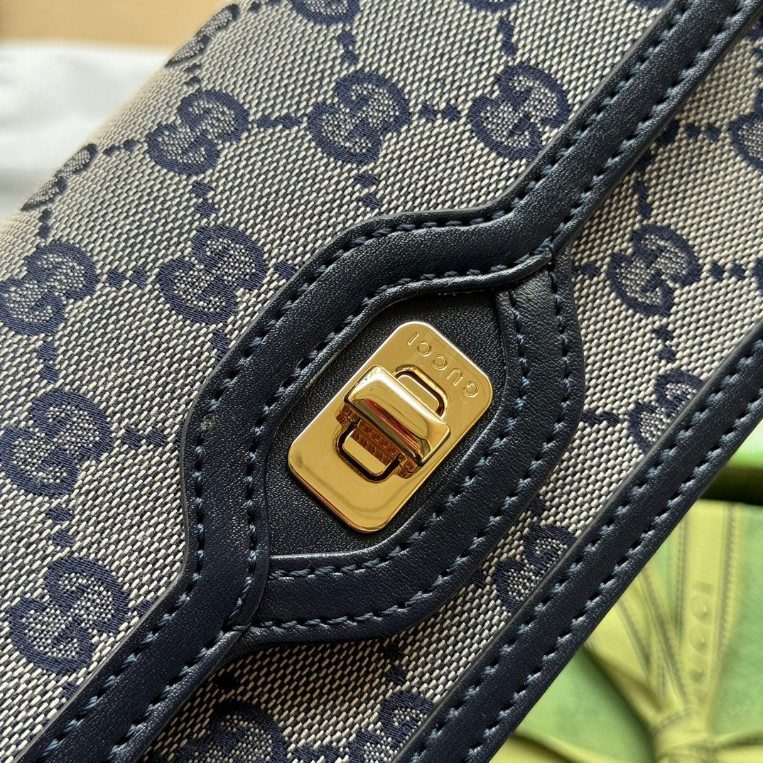 Mini sac bandoulière Luce 20 en toile gris clair et garniture en cuir de veau noir, matériel doré