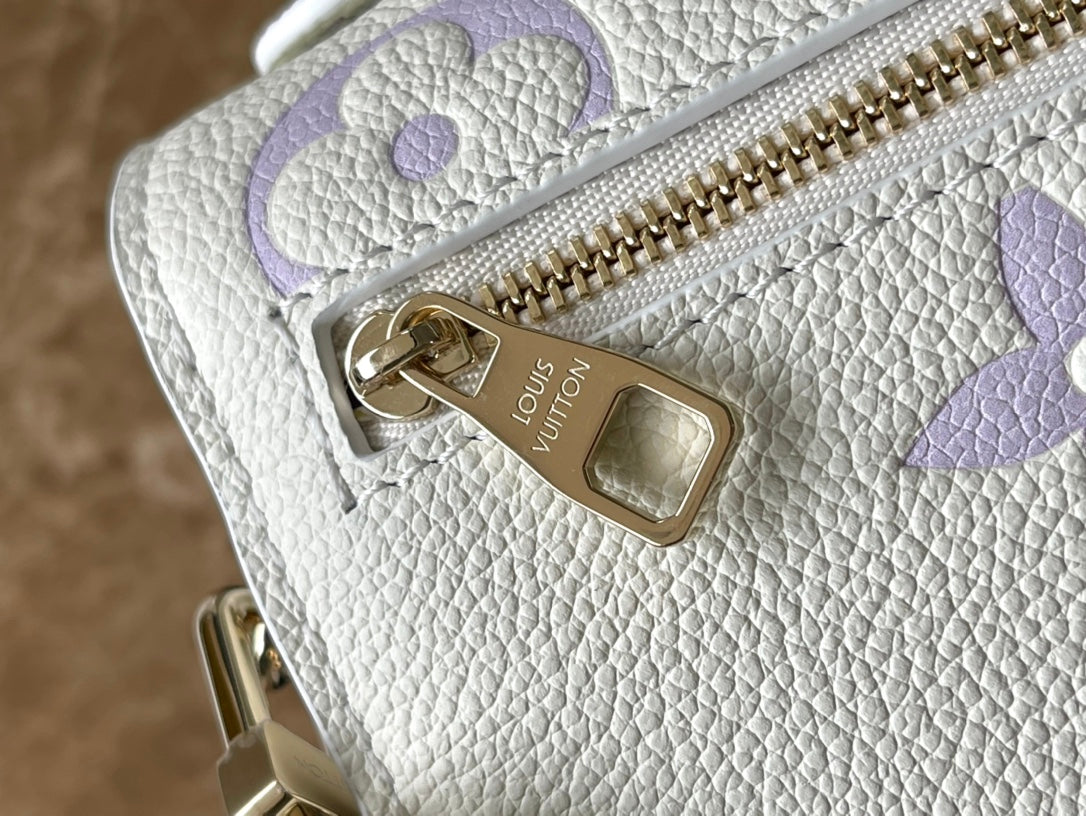 POCHETTE METIS EAST WEST 21 EN CUIR EMPREINTE MONOGRAMME BLANC VIOLET