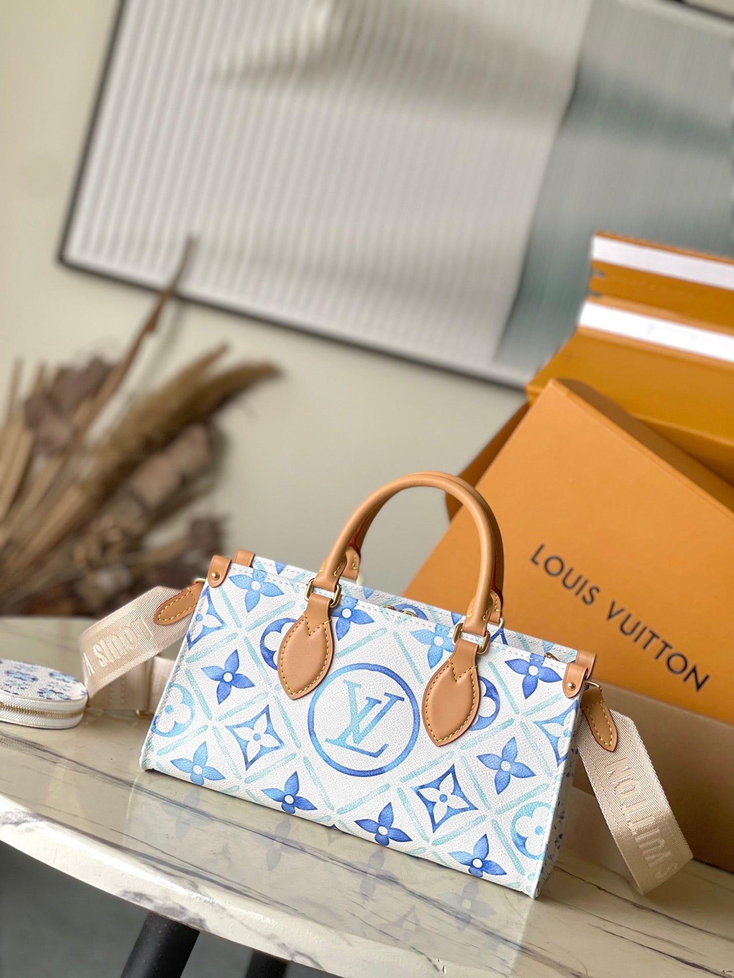 ONTHEGO EAST WEST 25 EN TOILE À CARREAUX MONOGRAMME BLEU LAGON