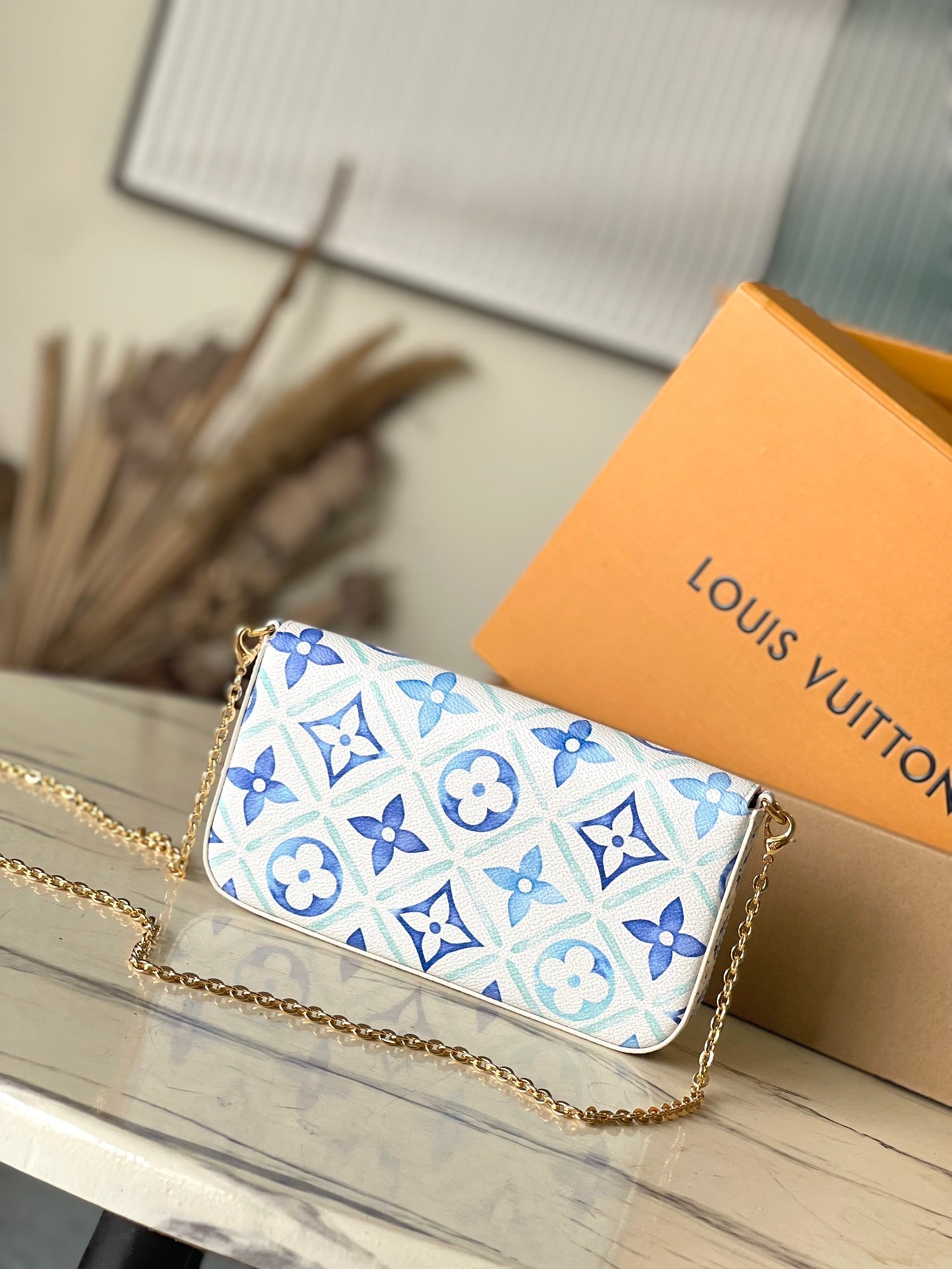 FÉLICIE POCHETTE 21 EN TOILE CARREAUX MONOGRAMME BLEU LAGON