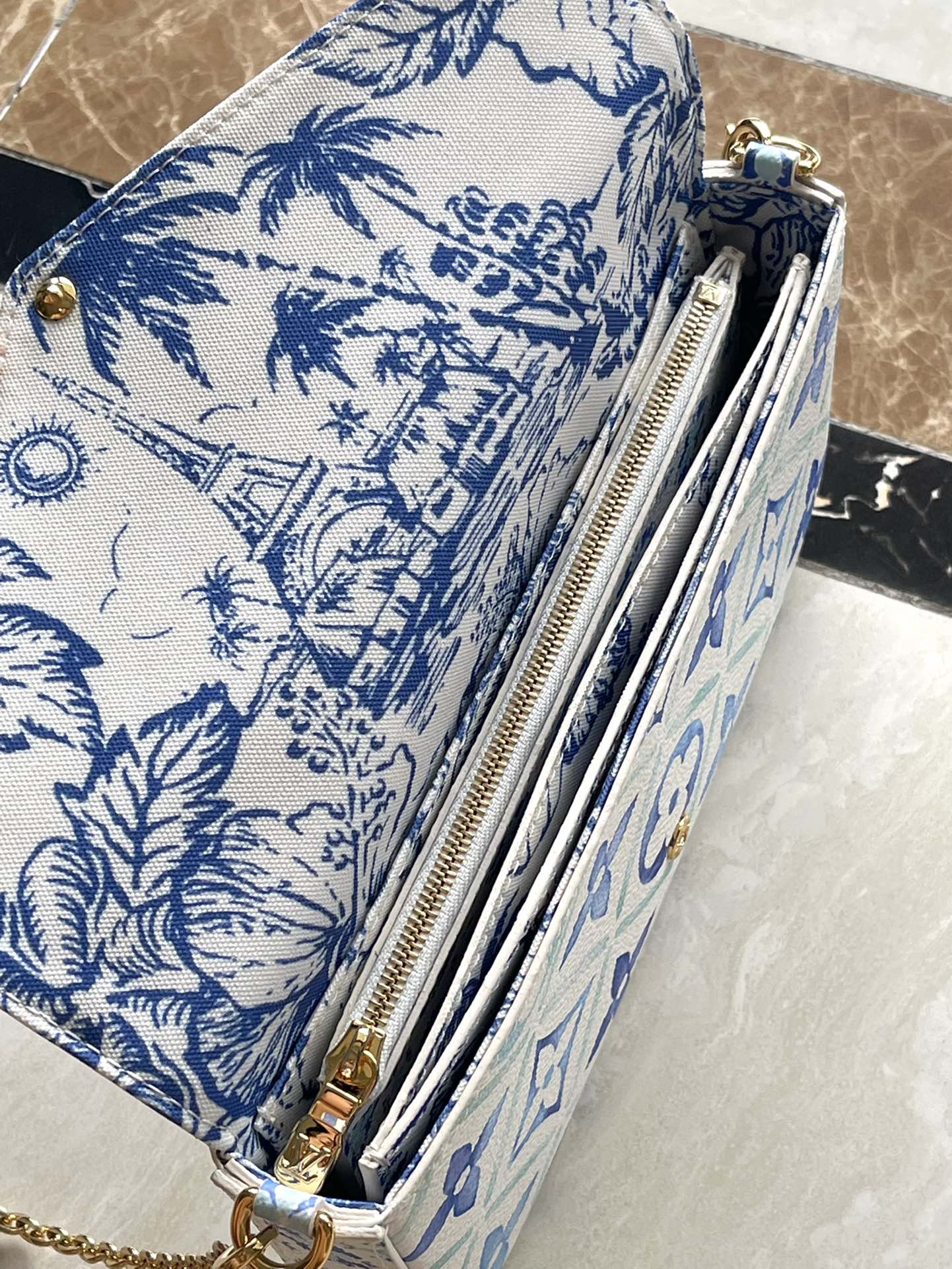 FÉLICIE POCHETTE 21 EN TOILE CARREAUX MONOGRAMME BLEU LAGON