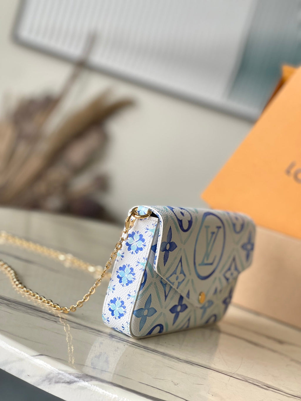 FÉLICIE POCHETTE 21 EN TOILE CARREAUX MONOGRAMME BLEU LAGON