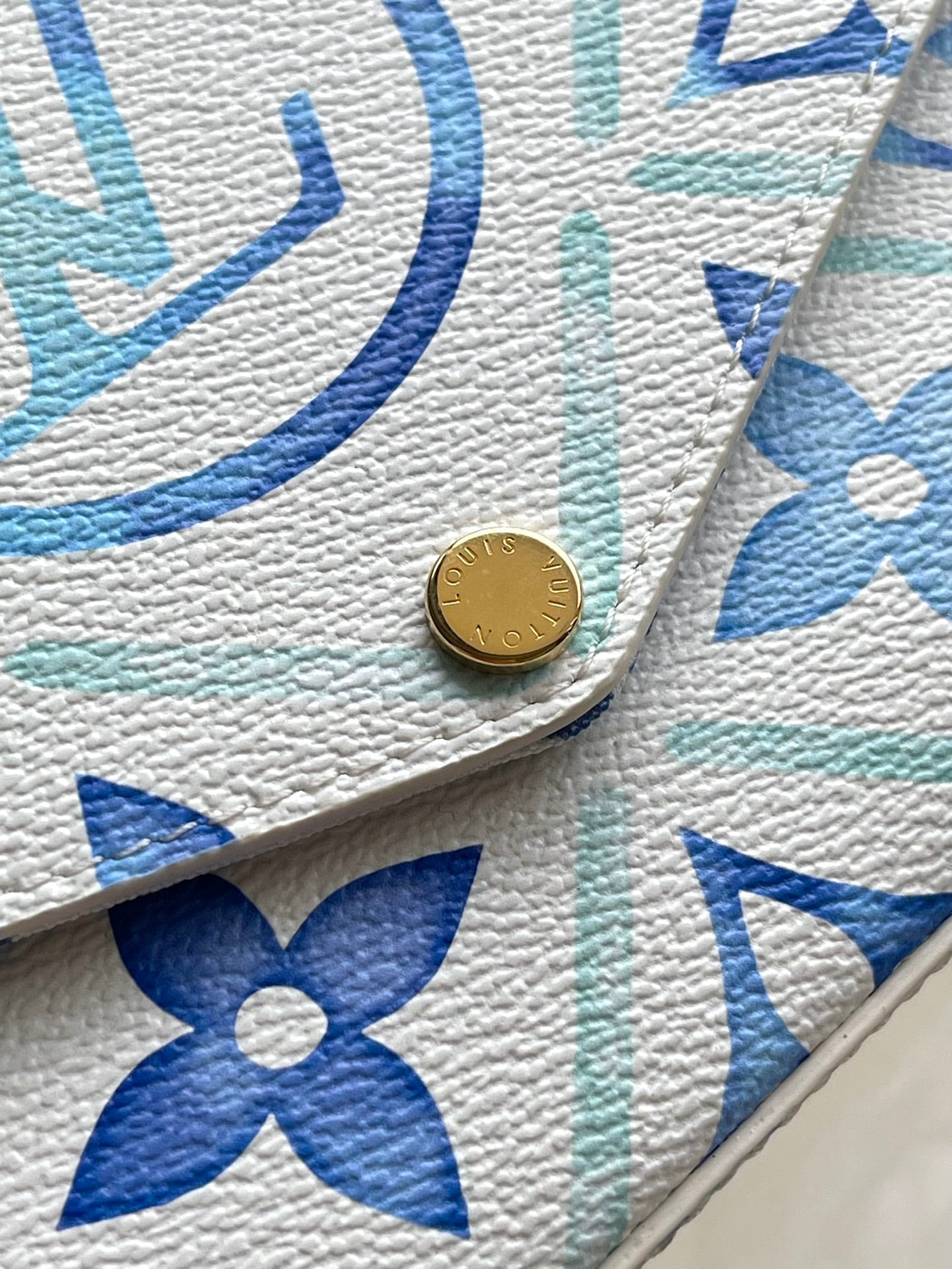 FÉLICIE POCHETTE 21 EN TOILE CARREAUX MONOGRAMME BLEU LAGON