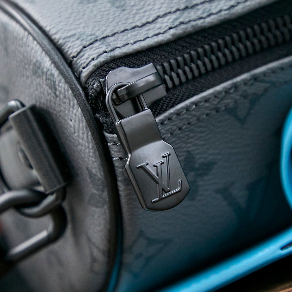 SAC BANDOULIÈRE KEEPALL 25 EN TOILE ÉCLIPSE MONOGRAMME GUN METAL CUIR DE VEAU TURQUOISE MIXTE
