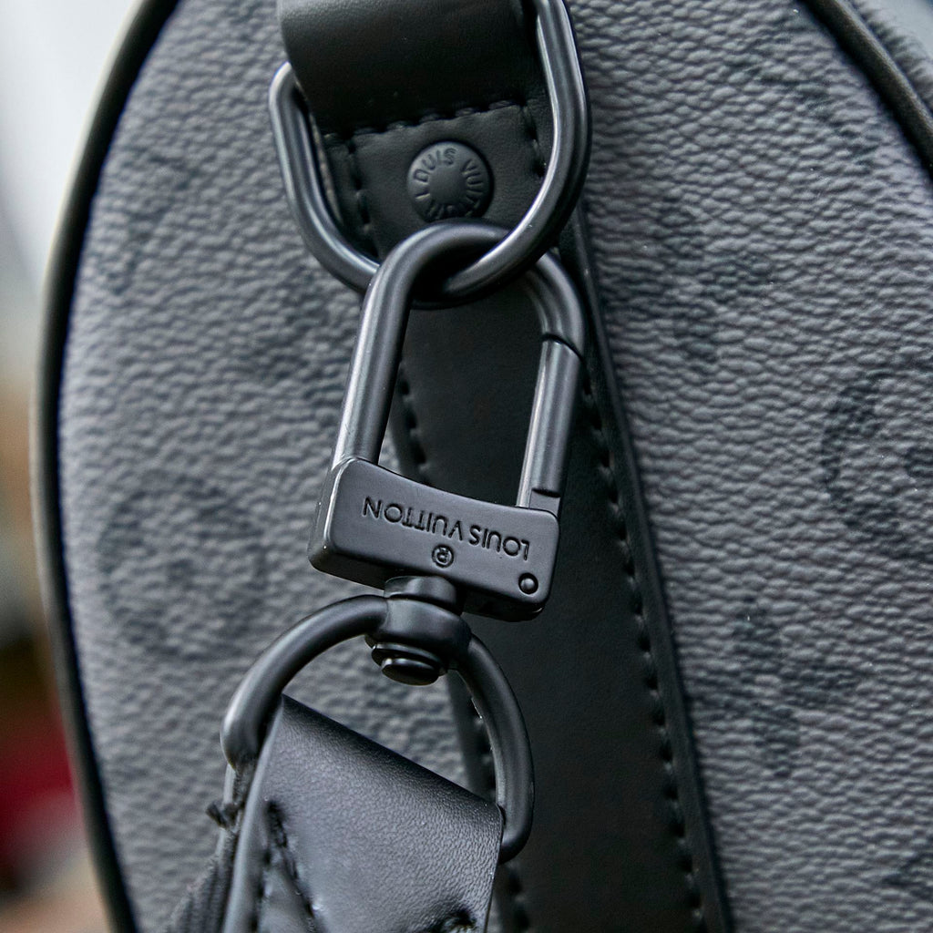 SAC BANDOULIÈRE KEEPALL 25 EN TOILE ÉCLIPSE MONOGRAMME GUN METAL CUIR DE VEAU TURQUOISE MIXTE