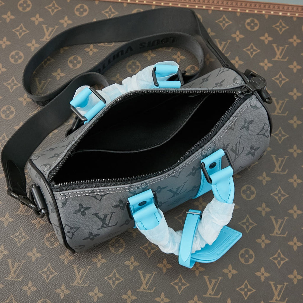 SAC BANDOULIÈRE KEEPALL 25 EN TOILE ÉCLIPSE MONOGRAMME GUN METAL CUIR DE VEAU TURQUOISE MIXTE