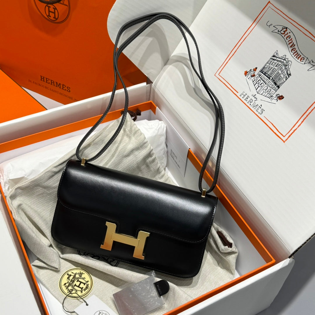 SAC HM CONSTANCE ELAN 24 CM EN CUIR DE VEAU BOX NOIR ET ACCESSOIRES DORÉS