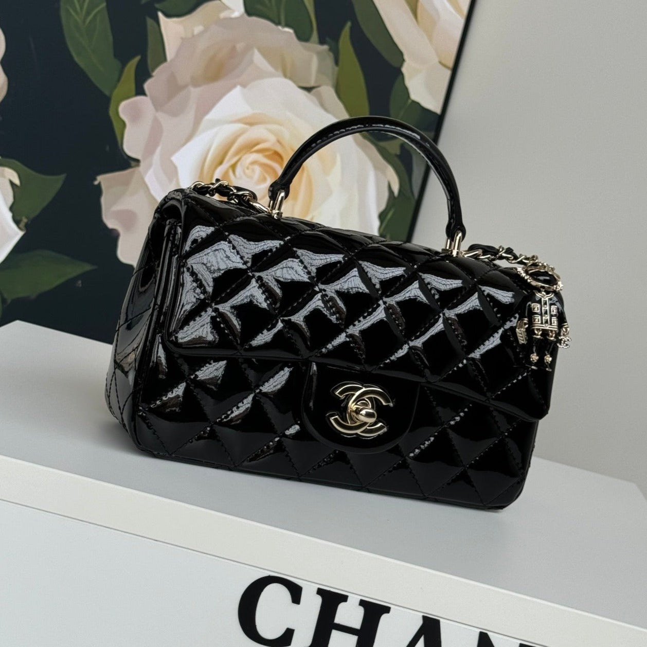 24C MINI FLAP BAG 20CM WITH TOP HANDLE BLACK PATENT CALFSKIN