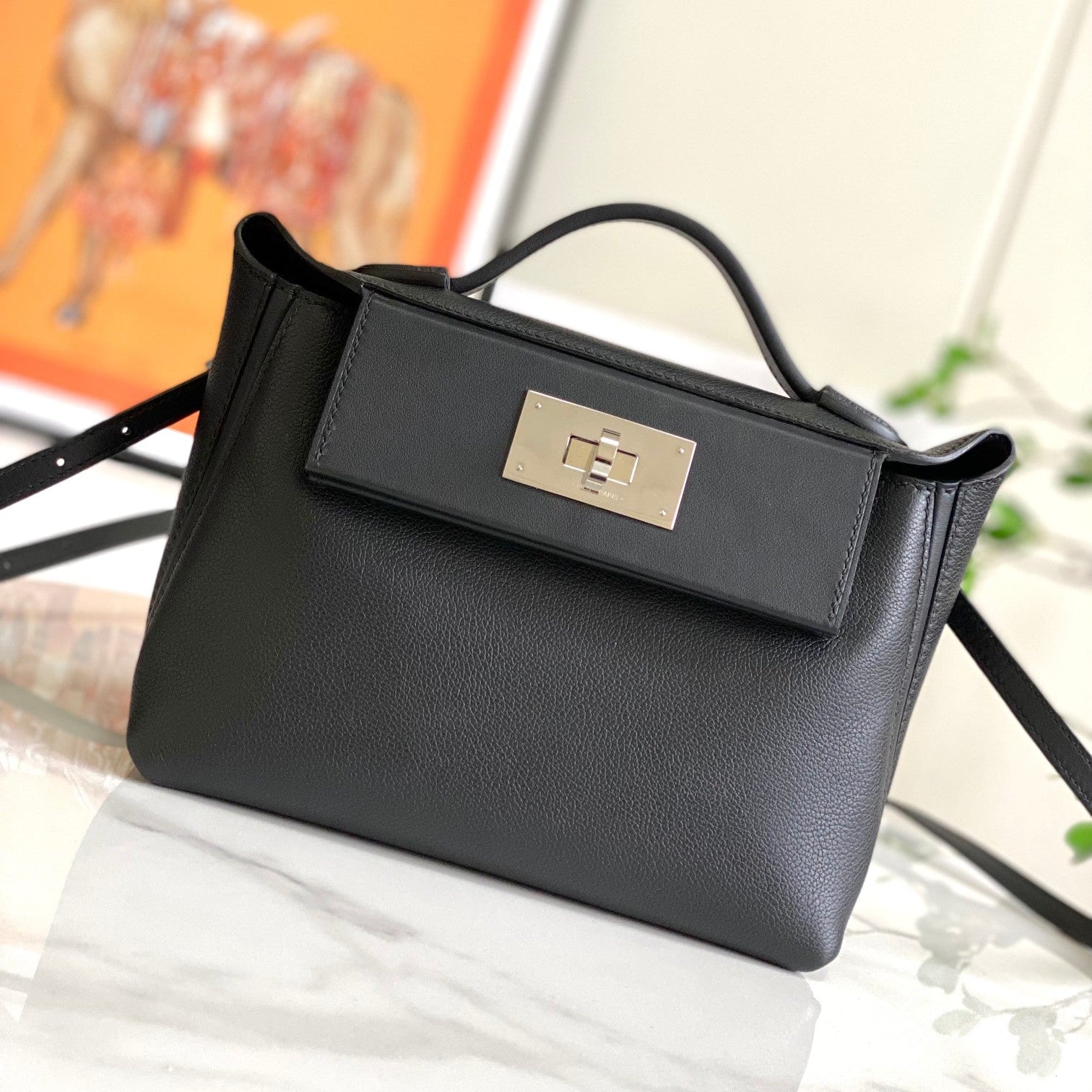 Mini sac HM 24/24 21 cm en cuir noir intemporel, matériel argenté