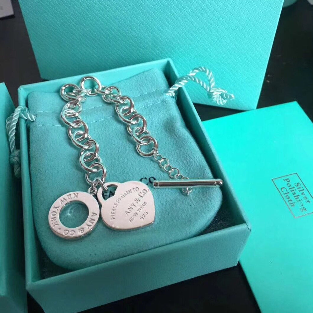 BRACELET EN ARGENT AVEC BOUCLE ARDILLON EN FORME DE CŒUR D'AMOUR RETOUR À TIF