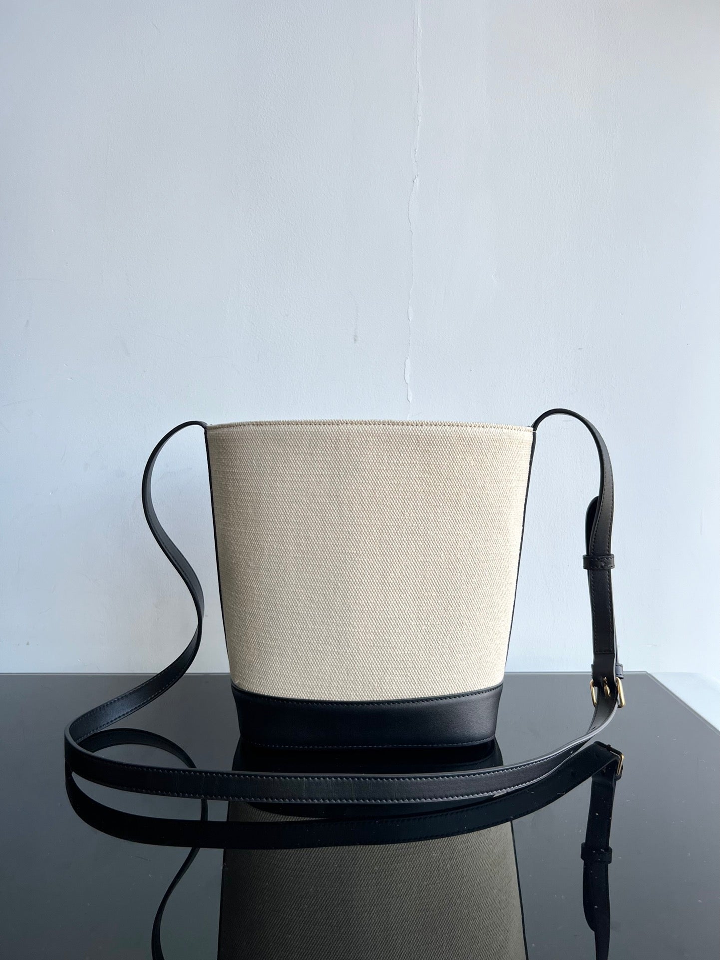 PETIT SEAU CUIR TRIOMPHE 24CM EN TEXTILE RAYÉ ET CUIR DE VEAU NOIR
