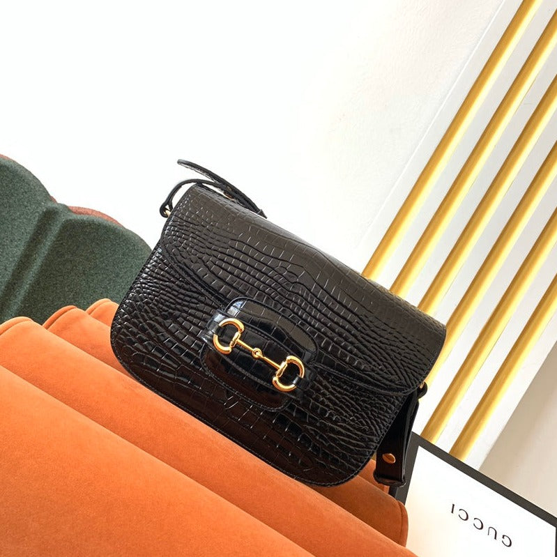 SAC À MORS GG 1955 25 CM EN CUIR DE CROCODILE NOIR ET QUINCAILLERIE DORÉ