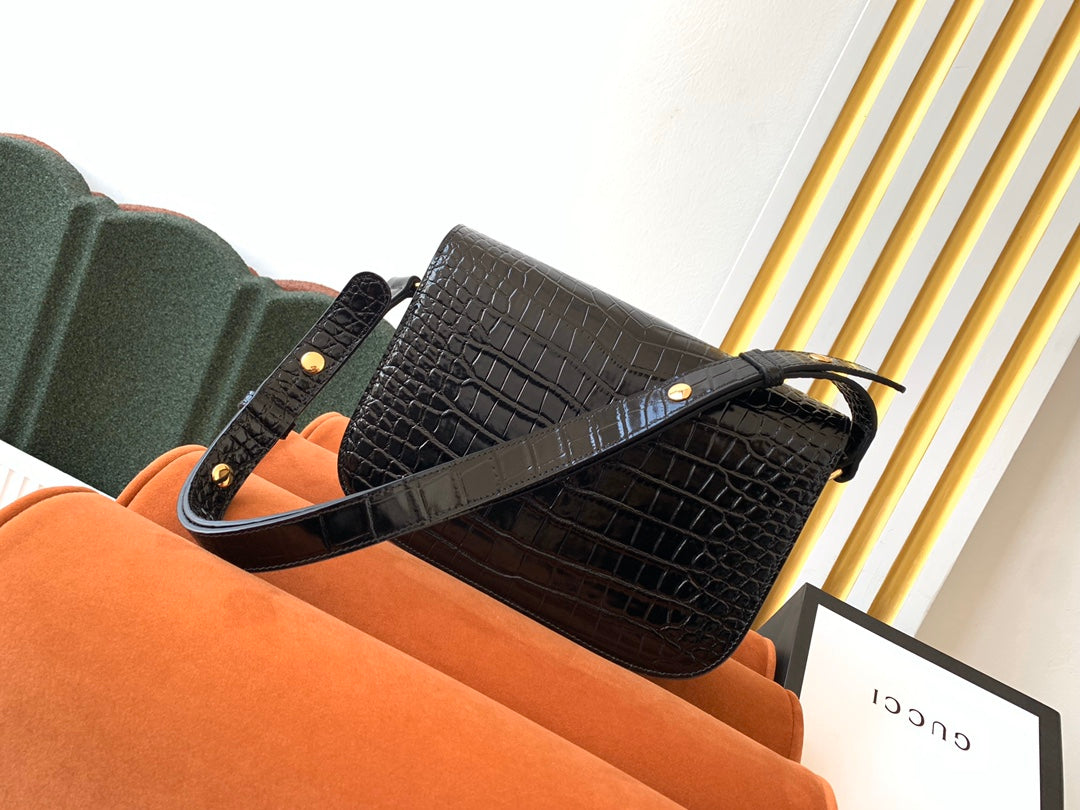 SAC À MORS GG 1955 25 CM EN CUIR DE CROCODILE NOIR ET QUINCAILLERIE DORÉ