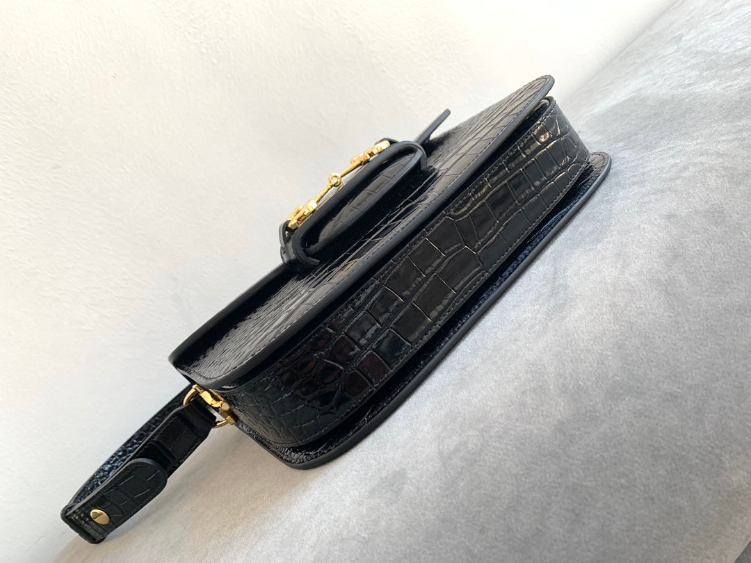 SAC À MORS GG 1955 25 CM EN CUIR DE CROCODILE NOIR ET QUINCAILLERIE DORÉ