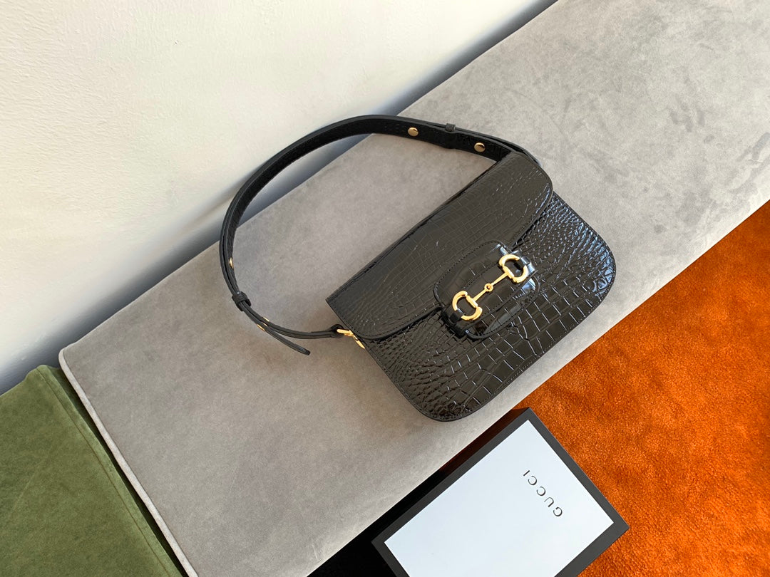 SAC À MORS GG 1955 25 CM EN CUIR DE CROCODILE NOIR ET QUINCAILLERIE DORÉ